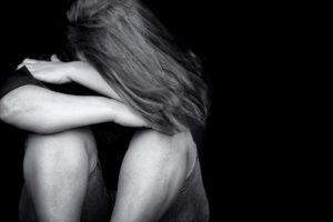Young woman crying depression violence