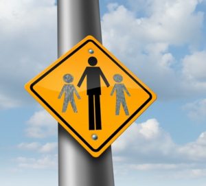 Child custody loss concept as a traffic sign with a father and two of his missing children as a family law symbol of social issues caused by divorce and separation.